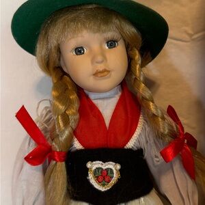 German Doll with Green Hat and Red Accents 13in